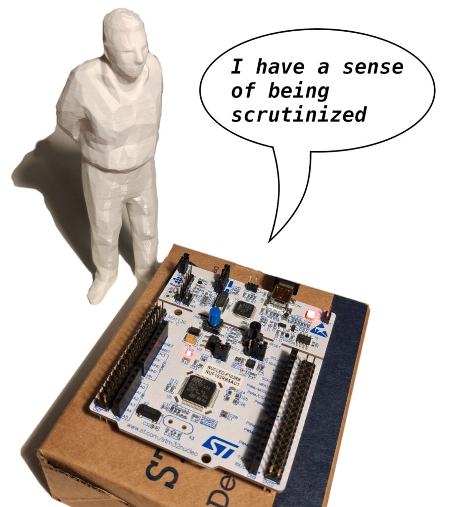 An umarell supervising a development board